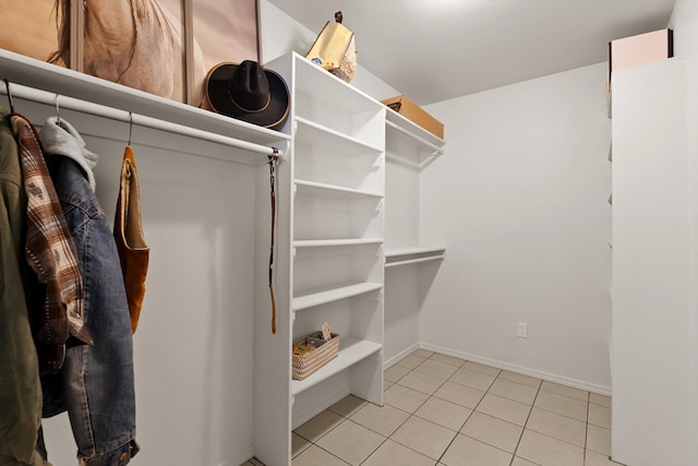 walk in closet featuring light tile patterned flooring