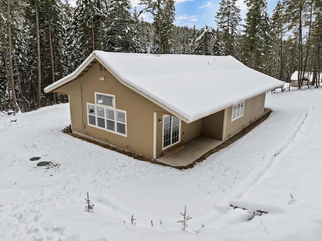 view of snow covered property