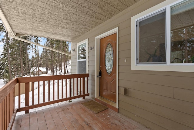 view of snow covered property entrance