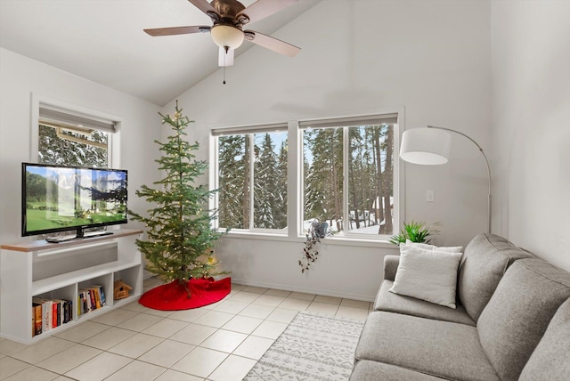 living room with ceiling fan, light tile patterned flooring, and vaulted ceiling