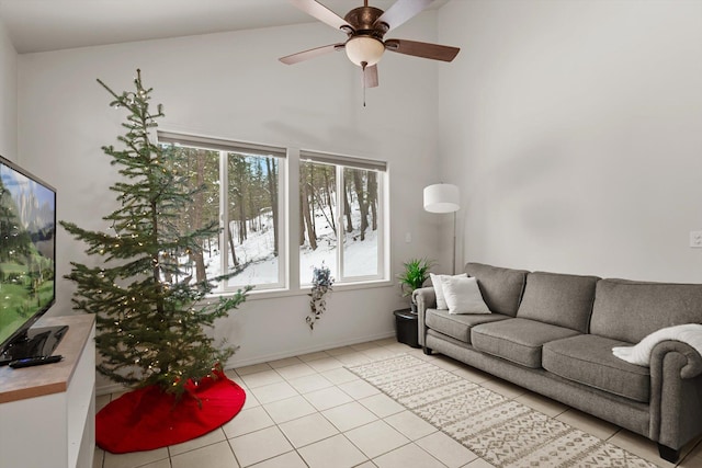 living room featuring light tile patterned floors, ceiling fan, and plenty of natural light