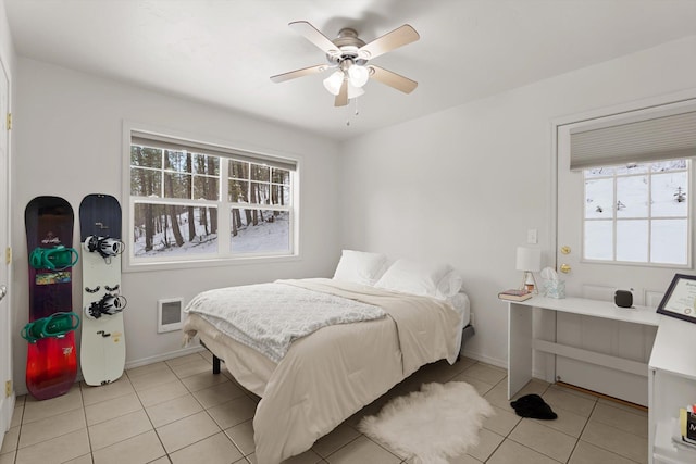 bedroom featuring ceiling fan and light tile patterned floors