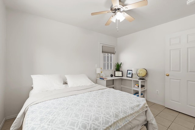 bedroom with ceiling fan and light tile patterned flooring