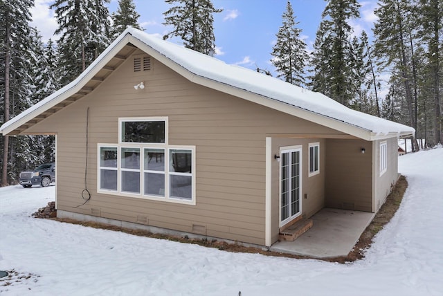 view of snow covered property