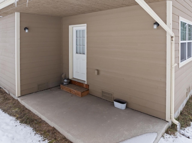 entrance to property with a patio area