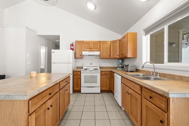 kitchen with lofted ceiling, white appliances, light tile patterned flooring, and sink