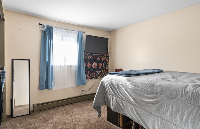 carpeted bedroom featuring a baseboard heating unit