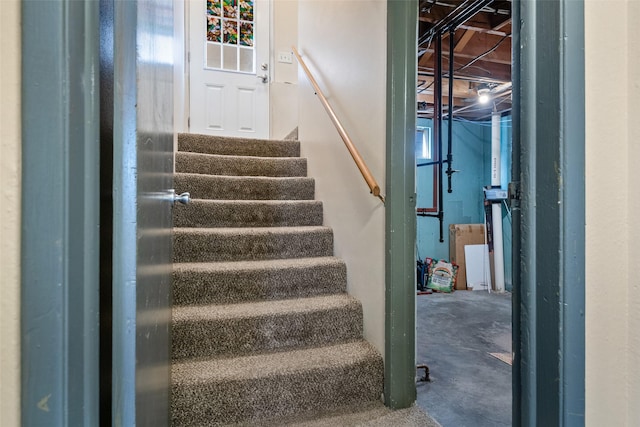 stairway featuring concrete floors