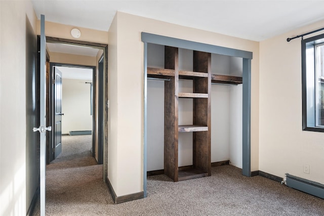 closet featuring a baseboard heating unit