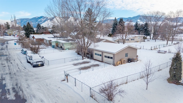 snowy aerial view featuring a mountain view