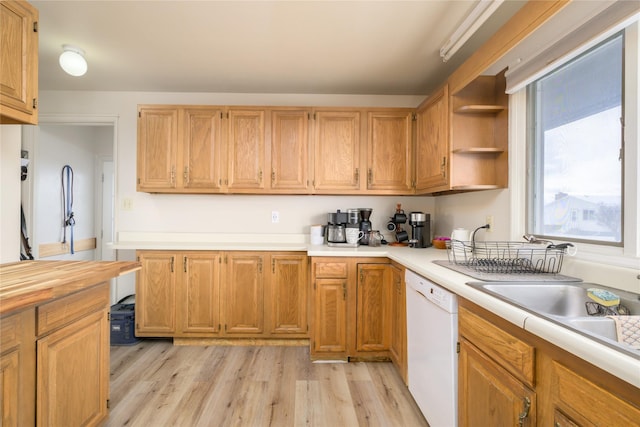 607 Oregon St, Deer Lodge, MT 59722 - kitchen with white dishwasher, light wood-type flooring, open shelves, an office area, and a sink