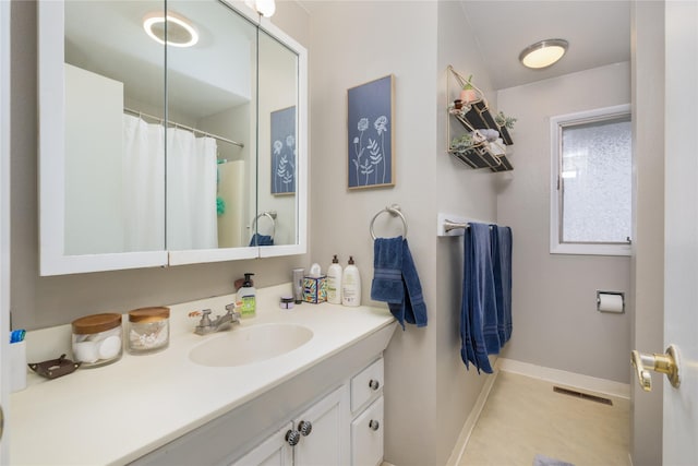 bathroom featuring vanity and tile patterned flooring