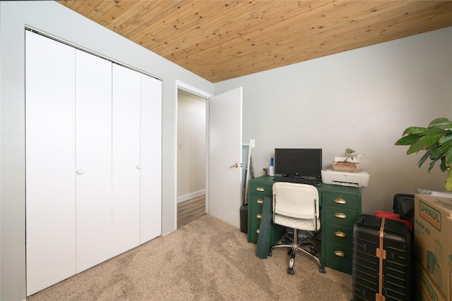 office area with wood ceiling and light colored carpet