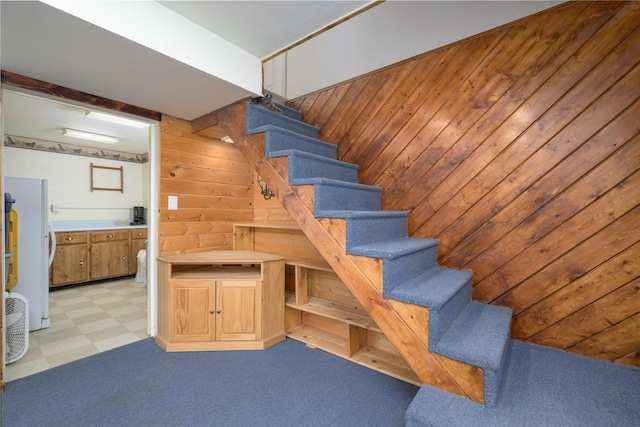 staircase with wooden walls