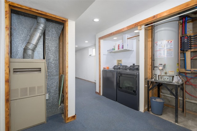 kitchen with washing machine and dryer, water heater, and carpet floors