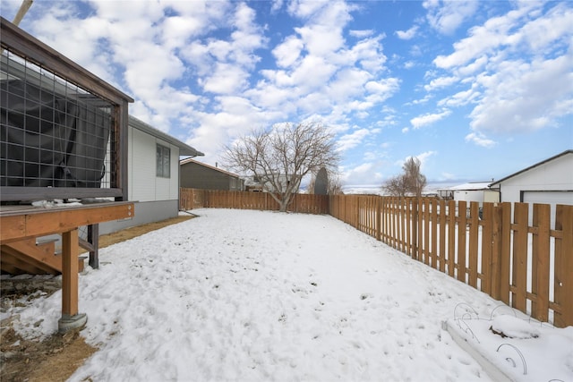 view of yard layered in snow