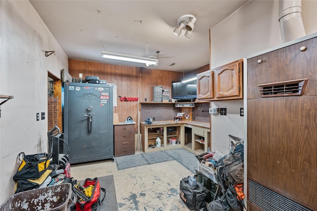 kitchen featuring wood walls