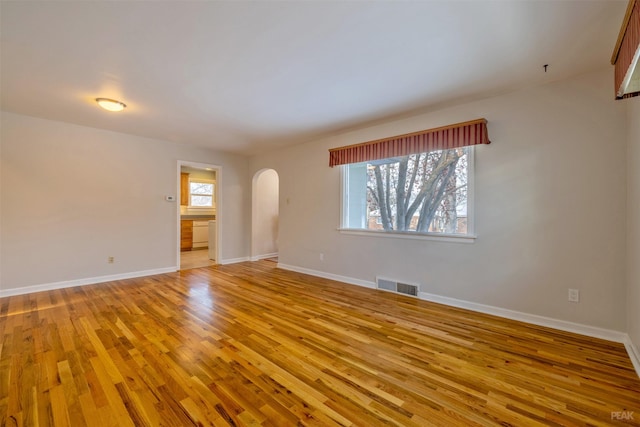 unfurnished room with light hardwood / wood-style floors