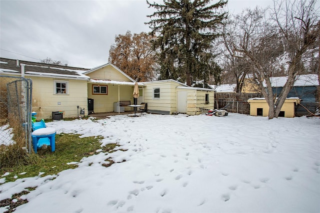 view of snow covered house