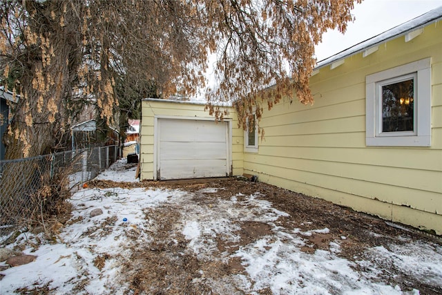 view of snow covered garage