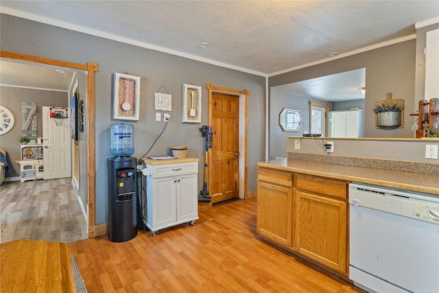 kitchen featuring a textured ceiling, dishwasher, crown molding, and light hardwood / wood-style flooring