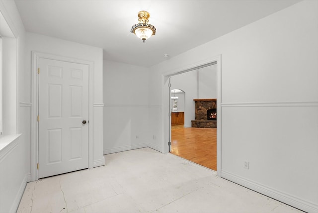 unfurnished room with a fireplace and light hardwood / wood-style flooring