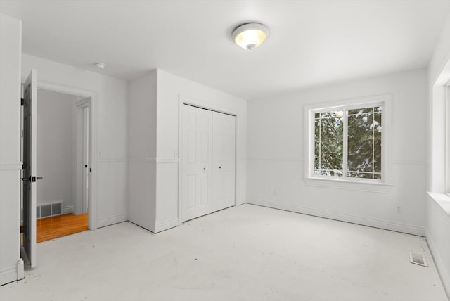 unfurnished bedroom with a closet