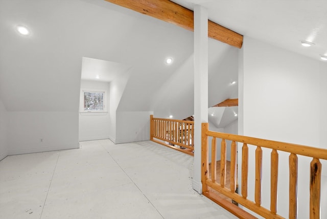 interior space with vaulted ceiling with beams