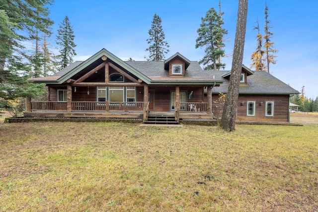 view of front facade featuring a front yard and covered porch