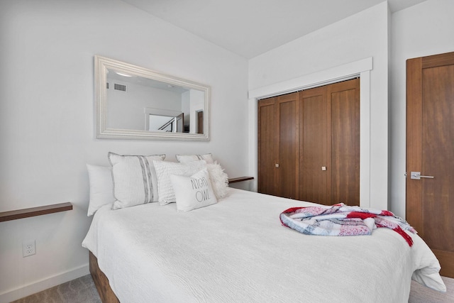 bedroom with a closet and carpet