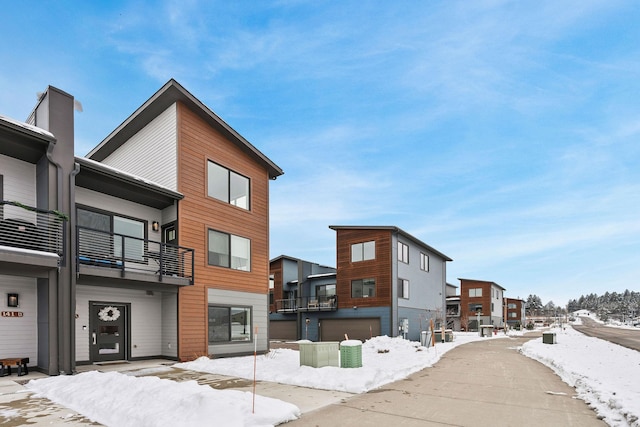 141 Hawthorne Ct Unit A, Whitefish, MT 59937 - snow covered building featuring a residential view