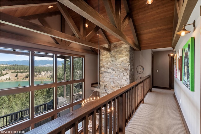 hall featuring wood ceiling, a wealth of natural light, and a chandelier