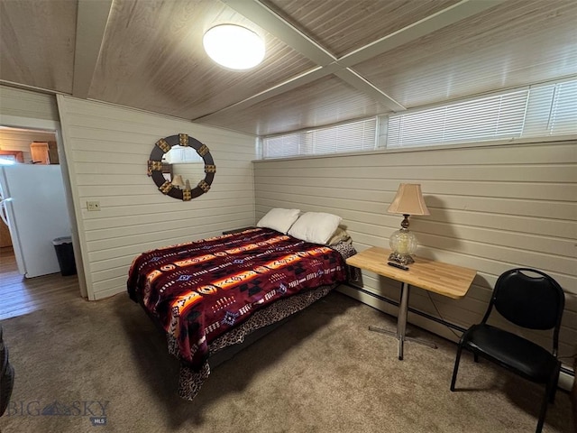 carpeted bedroom featuring white refrigerator