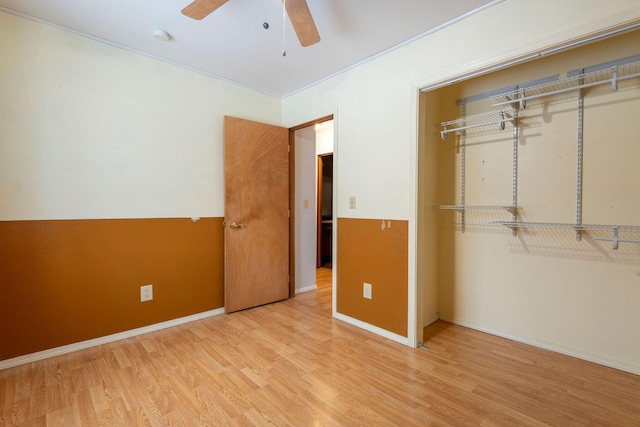 unfurnished bedroom with ceiling fan, light hardwood / wood-style floors, and a closet