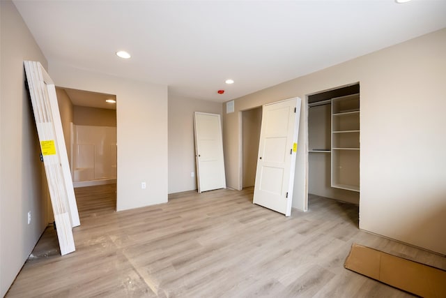 unfurnished bedroom with light hardwood / wood-style flooring