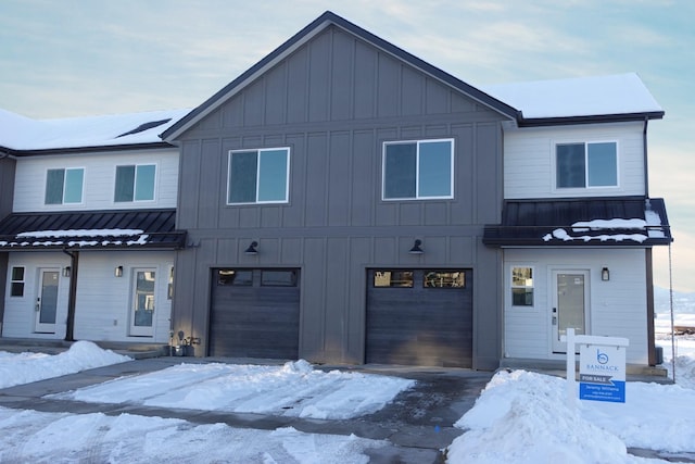 modern inspired farmhouse with a garage