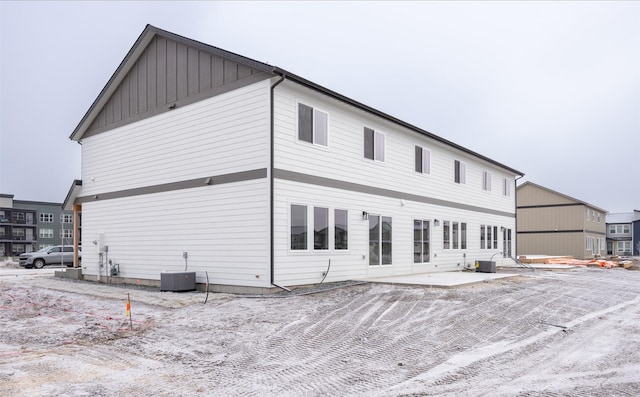 rear view of house featuring a patio and central AC unit