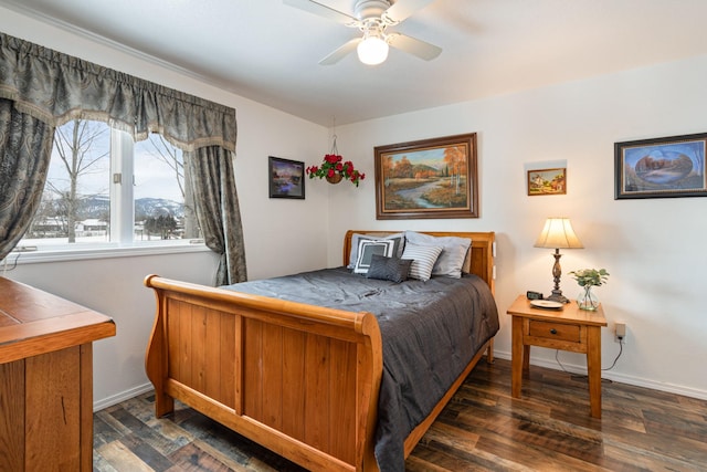 bedroom featuring ceiling fan and dark wood-type flooring