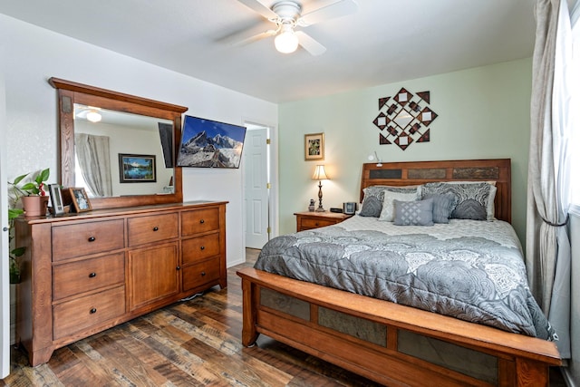 bedroom with ceiling fan and dark hardwood / wood-style floors