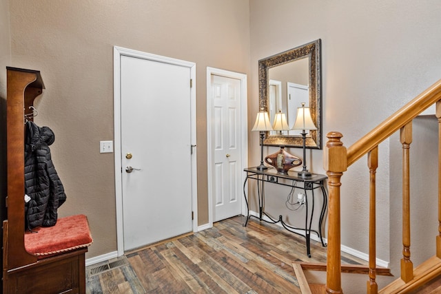 entrance foyer featuring dark hardwood / wood-style floors