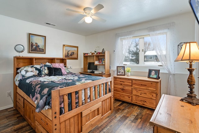 bedroom featuring ceiling fan and dark hardwood / wood-style floors