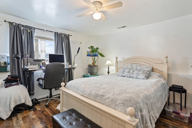 bedroom featuring ceiling fan and dark hardwood / wood-style floors