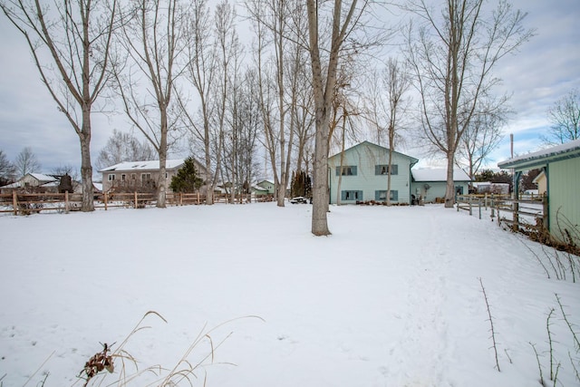 view of yard covered in snow