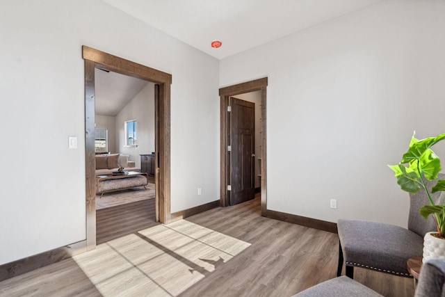 sitting room with light wood-style flooring and baseboards