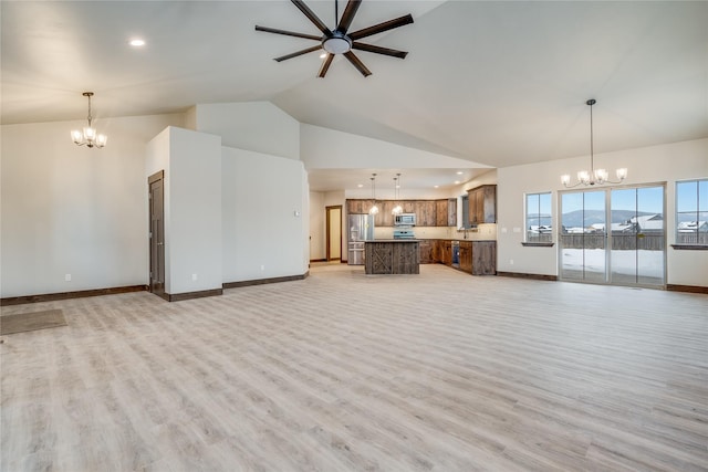 unfurnished living room featuring light hardwood / wood-style floors, high vaulted ceiling, and ceiling fan with notable chandelier