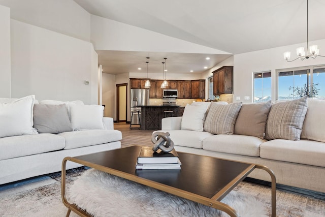 living area featuring lofted ceiling, a notable chandelier, recessed lighting, and light wood-style floors