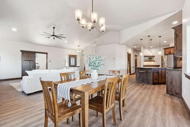 dining area featuring recessed lighting, ceiling fan with notable chandelier, light wood-style floors, and vaulted ceiling