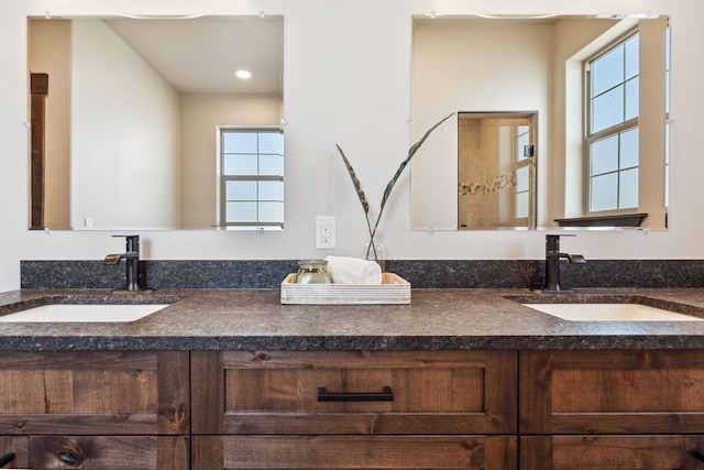 bathroom with double vanity and a sink