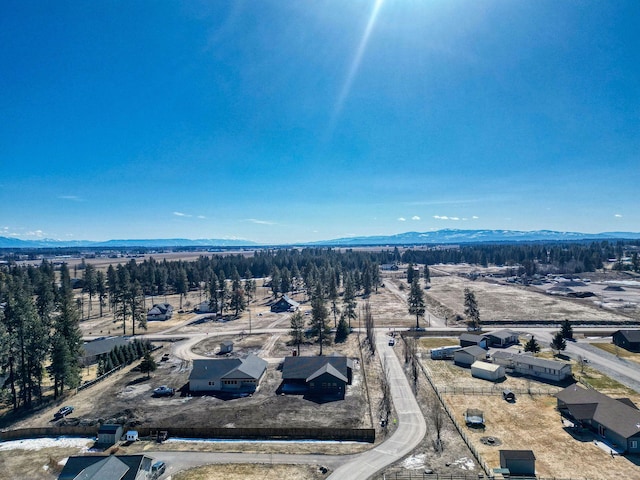 birds eye view of property featuring a mountain view