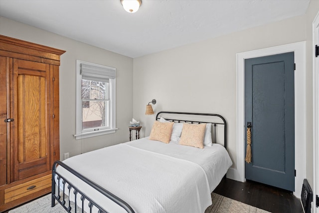 bedroom featuring dark wood-type flooring